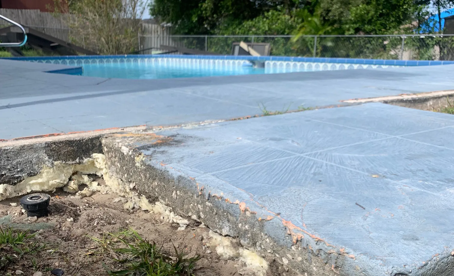 Pool deck edge with polyurethane foam filling the void underneath